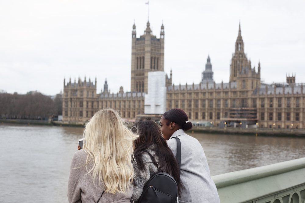 Students by the Houses of Parliament, London